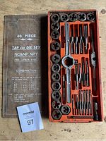 Photo showing the full open case with all 40 pieces including dies, taps, tap wrench and accessories organized neatly