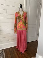 Front full view of dress on mannequin showing silhouette and print on white background