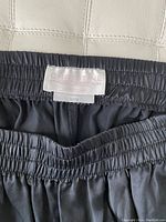 Close-up image of the label on the waistband showing brand 'Christine Lingerie' and size medium (M/M).