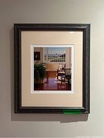 Full view of the framed artwork hung on wall