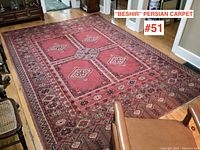 Full view of carpet on hardwood floor showing overall pattern and condition