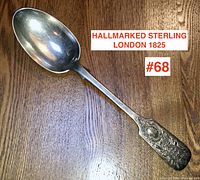Full view of the Georgian sterling serving spoon showing the hallmark and overall shape