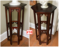 Pair of hexagonal dark wood plinth style side tables with decorative cut-out details on sides, standing on hardwood floor.