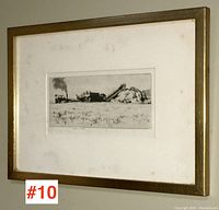 Framed wood block print showing rural agricultural scene with machinery and haystack.