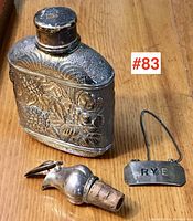 All items showing flask, wine pourer and decanter label