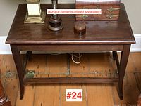Full front view of the rectangular walnut side table with polished surface and some decorative objects on top (not included).