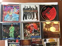 Top view of front row CDs including Take 6, The Temptations, Nat King Cole Christmas album, Handel Messiah album, and Roots of Rock 1956 Rock n Roll.