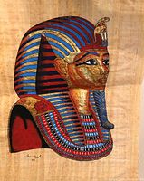 Close-up photo of the hand-painted Egyptian queen's head on papyrus, showing vibrant colors and detailed headdress.
