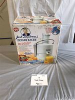 Box showing front image of Jack LaLanne Power Juicer, highlighting fast and healthy fresh juice.
