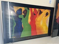 Framed print titled 'Thanks and Praises' featuring colorful dancing women by Bernard Stanley Hopes