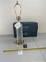 Full view of Waterford crystal table lamp with brass base and original box, showing lamp height about 16 inches.