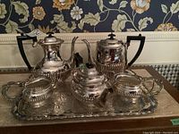 Full view of Birks silver plated tea set with tray showing teapot, coffee pot, sugar bowl, creamer, and tray.