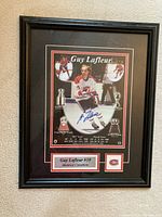 Front-facing shot of framed print on wall showing full piece