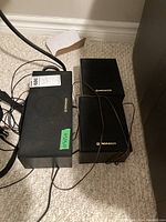 Top view of three Pioneer speakers, showing one larger CS-X380-K model and two smaller CS-C180-K models with wires attached.