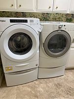 Both appliances side by side in laundry room