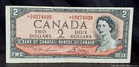 Front of 1954 Canadian $2 banknote with asterisk serial number and portrait of Queen Elizabeth II.