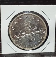 Obverse side showing the canoe and date 1959 with CANADA and DOLLAR inscriptions.