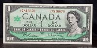 Front side of the 1967 Canadian Centennial one dollar bill showing Queen Elizabeth II portrait, serial number 7816670, bilingual text.