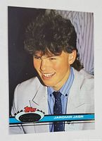 Front of the 1990-91 Topps Stadium Club Jaromir Jagr Rookie Card showing Jaromir Jagr in a suit and tie, with logo and player name.