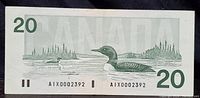 Back of 1991 Canadian $20 replacement note showing detailed illustration of loon on a lake, serial number AIX0002392, and denomination.