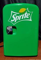Front view of green Sprite mini fridge unit showing Sprite logo and chrome handle.