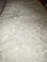 Full view of king size duvet cover laid out on a bed showing floral pattern and texture