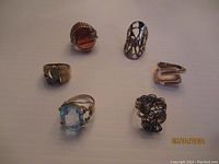 Overview of six rings arranged on white background