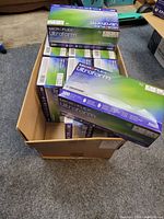 Cardboard box containing 9 boxes of Microflex Ultraform nitrile gloves size M.