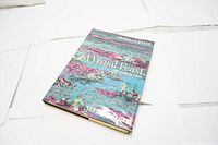 Front cover of 'A Visual Feast' showing photographic cover art with aquatic plants and flowers in tones of blue, pink, and green.