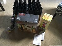 Wine bottle cleaner racks, Enolmatic filler box and another boxed item for wine making, with instruction manuals