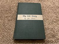 Front cover of 'My Life Story' by Joe Louis, showing title on a beige horizontal strip on dark green cover.