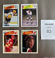 Four close-up cards showing Mario Lemieux, Wayne Gretzky, Joe Nieuwendyk, and Brendan Shanahan hockey cards from the 1988-89 O.P.C. set.