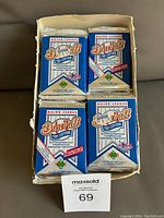 Top view of partial wax box with 4 rows of sealed blue foil packs labeled Major League Baseball 1991 Edition.