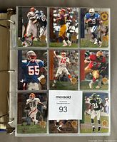 Binder page displaying nine different football cards featuring players in action poses, with gold SP logos on lower corners.