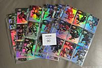 Spread of multiple hockey cards from the 1998-99 Topps Gold Label set showing reflective, multi-colored backgrounds and players in action poses.