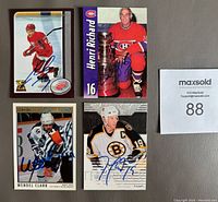 Four autographed cards featuring Henri Richard, Wendel Clark, Joe Thornton and Pavel Datsyuk shown close-up.