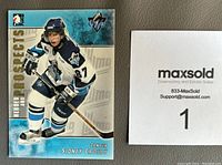 Front of Sidney Crosby hockey card showing him skating in uniform with number 87, card number visible as 104 in the series.