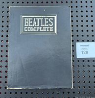 Front cover of the Beatles Complete Songbook showing wear and some damage on edges.