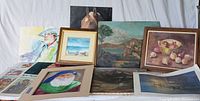 Group of framed and unframed vintage and antique paintings and prints including still life, portraits, landscapes, and whimsical caricatures.