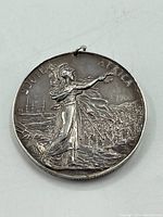 Full reverse view showing Britannia, troops landing, SOUTH AFRICA inscription and ghost date