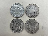 Top side showing obverse and reverse of all four coins, details of inscriptions, dates, and design elements for identification.