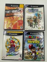 Four Nintendo GameCube game cases displayed together showing front covers of each game.