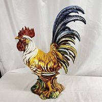 Front view of the painted ceramic rooster on a white backdrop