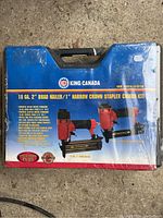 Photo of the blue plastic carrying case with King Canada branding labeled 18 GA 2" Brad Nailer / 1" Narrow Crown Stapler Combo Kit.
