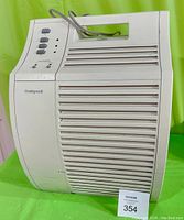 Front view of Honeywell air purifier with control buttons and vents.