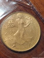 Close-up image of one 200 Lire coin from the 1981 set showing agricultural motif and date