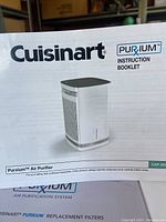 Instruction booklet for Cuisinart Purxium Air Purifier showing the product image and brand details.