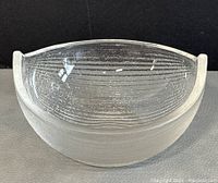 Front angled view of the translucent ice glass boat-shaped bowl showing textured horizontal ridges and smooth interior.