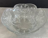 Clear glass cow parsley bowl showing embossed floral patterns inside and scalloped round shape