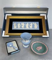 Lot contents showing all items together including framed plaque, mini vase, plate, and spoon